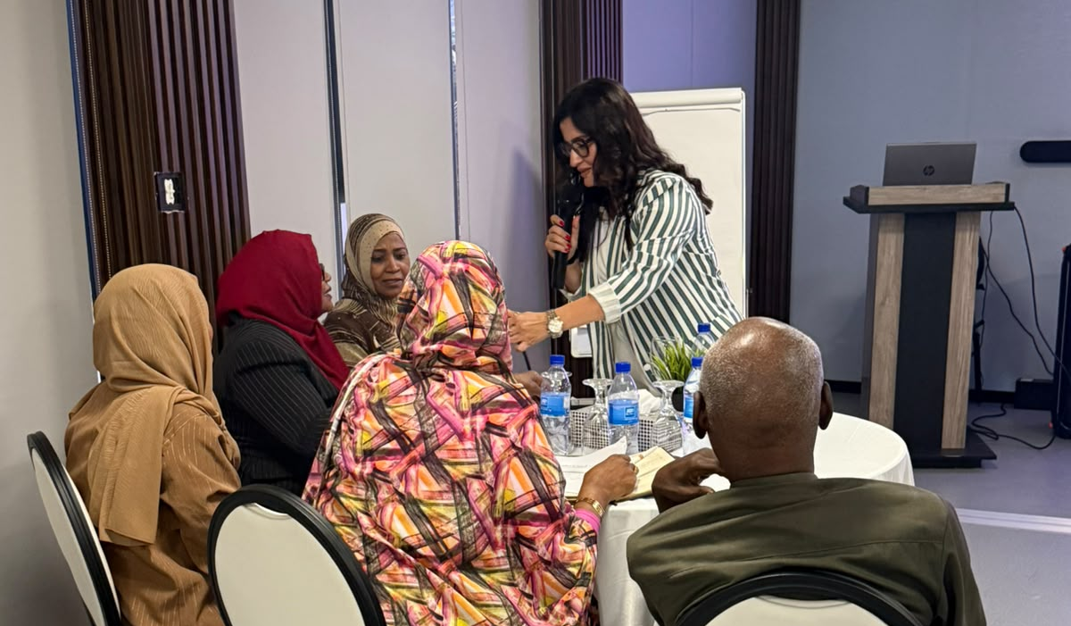 Presenter discussing with working group