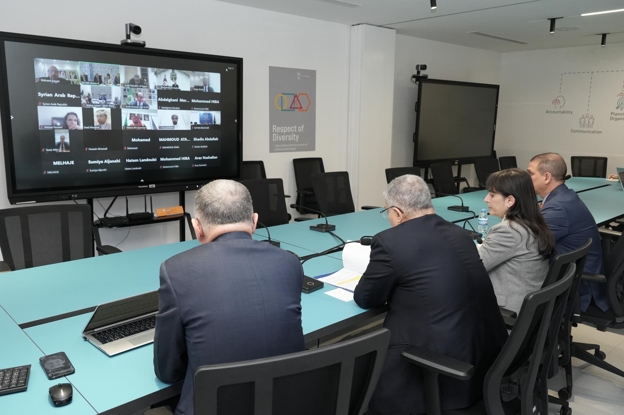 ESCWA senior executives facing screen showing participants online