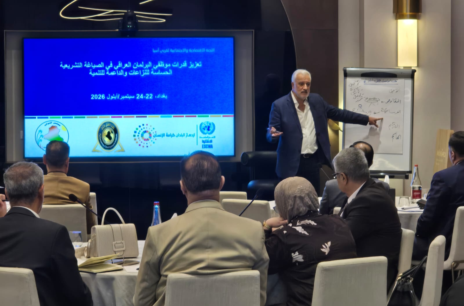 Man presenting at a screen
