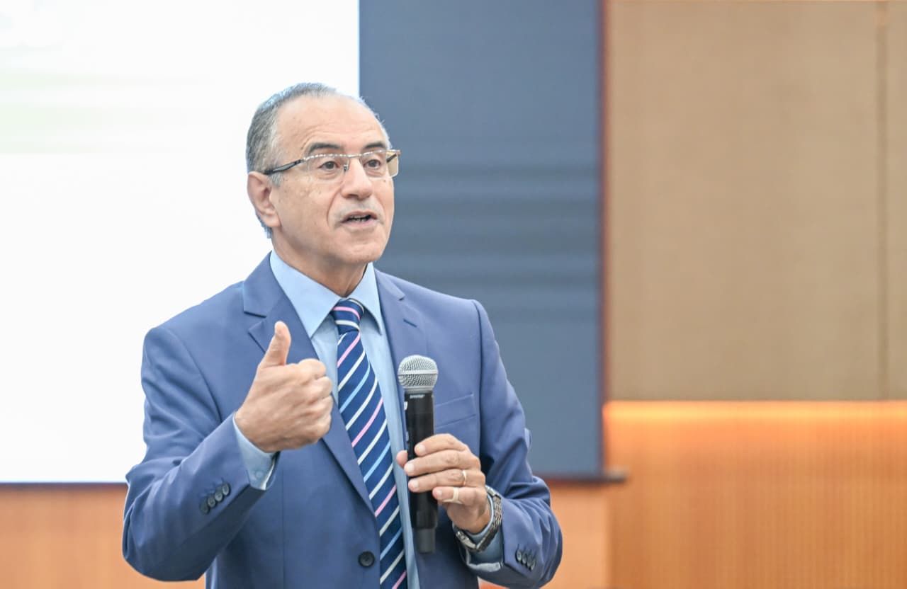 A close up of an official from ESCWA in a blue suit addressing the audience