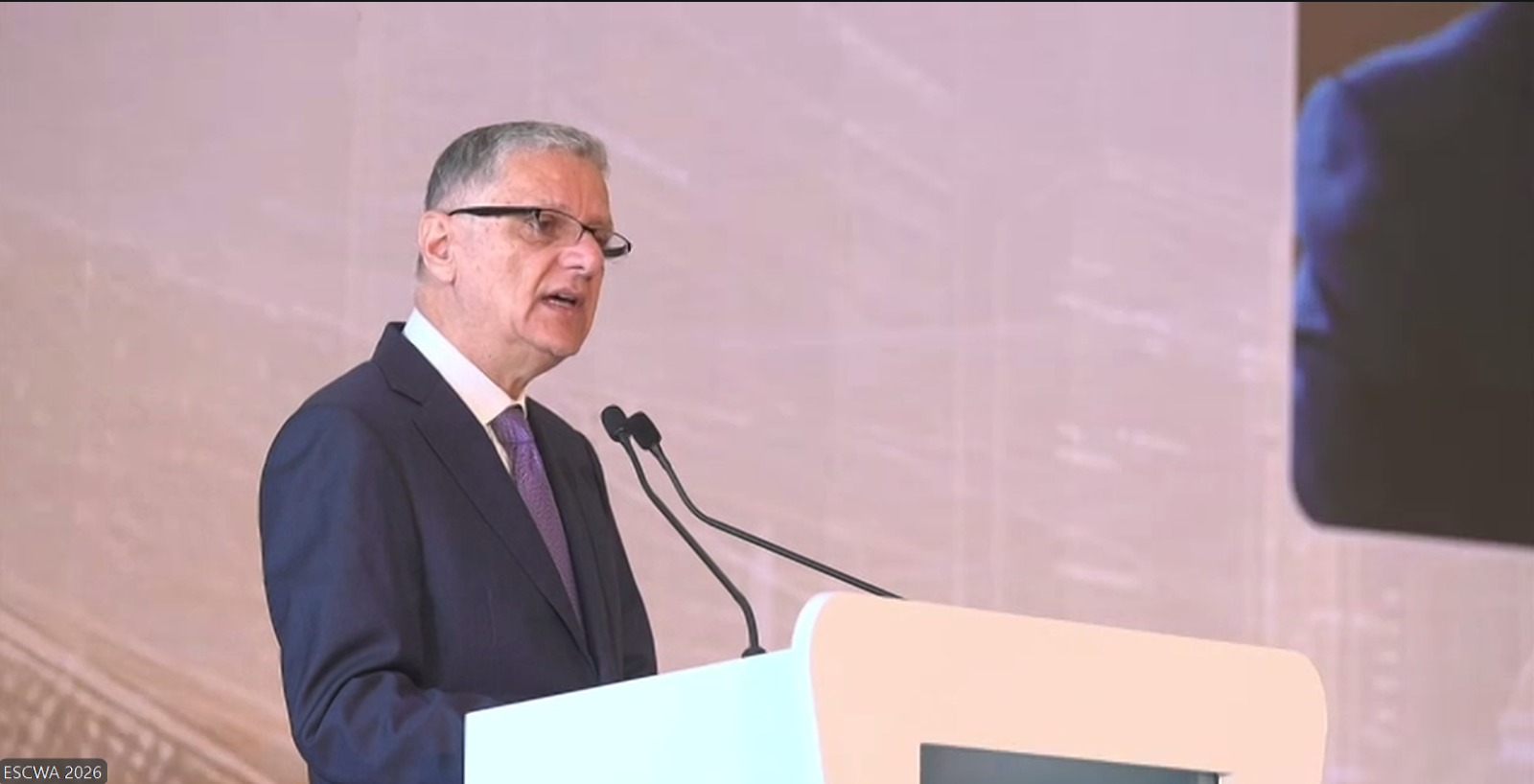 Man speaking on podium