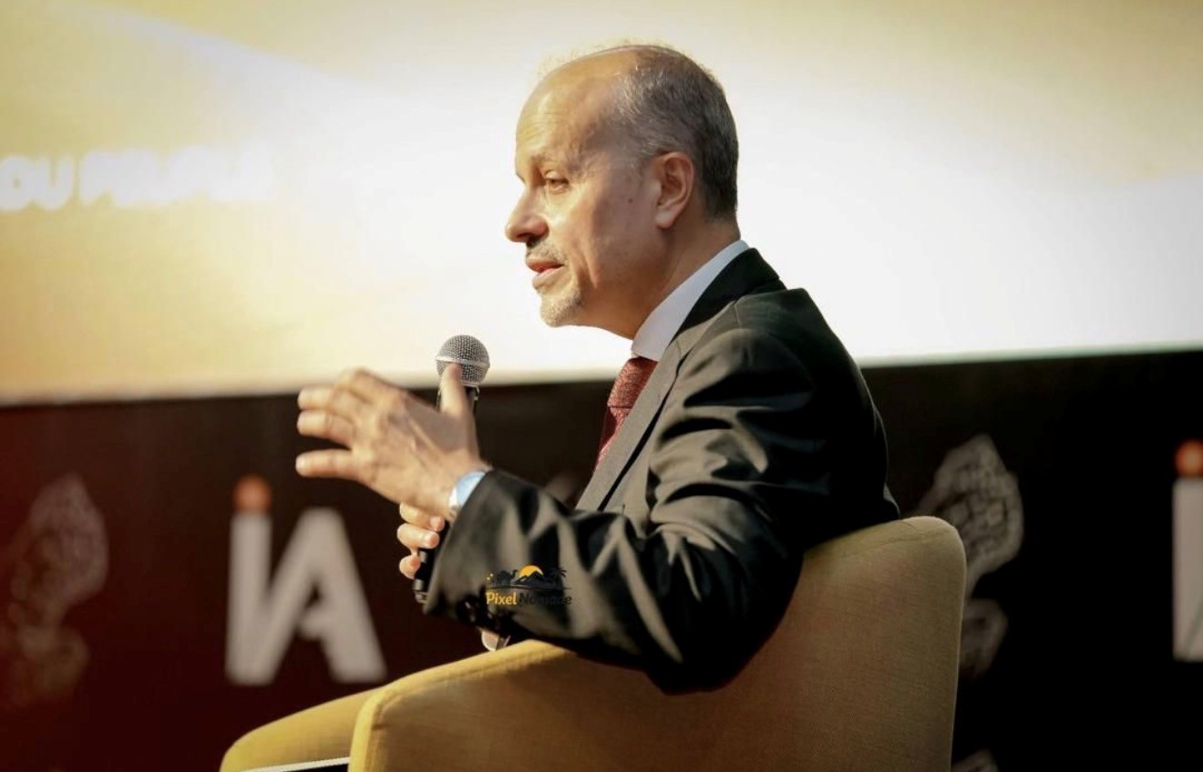 Close up of a man with a microphone in a couch 