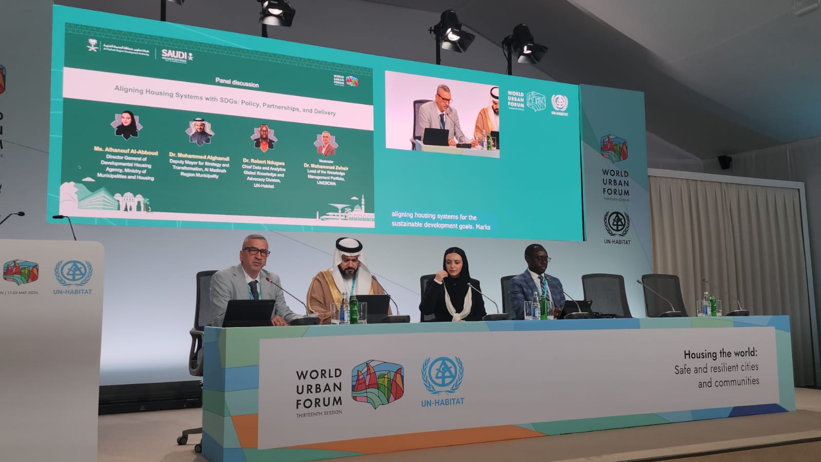 Panelists behind a table
