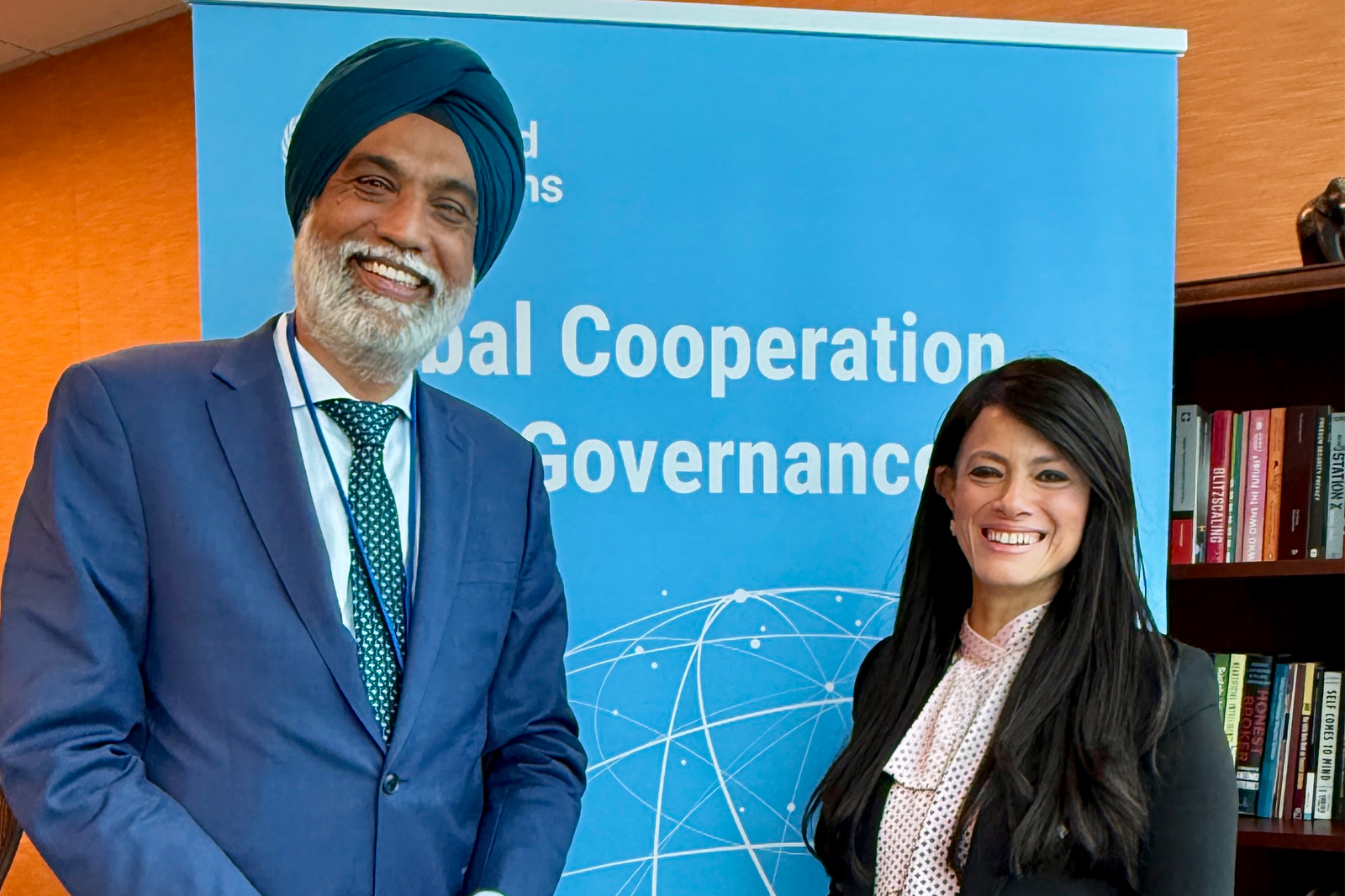 Two officials posing for the photo