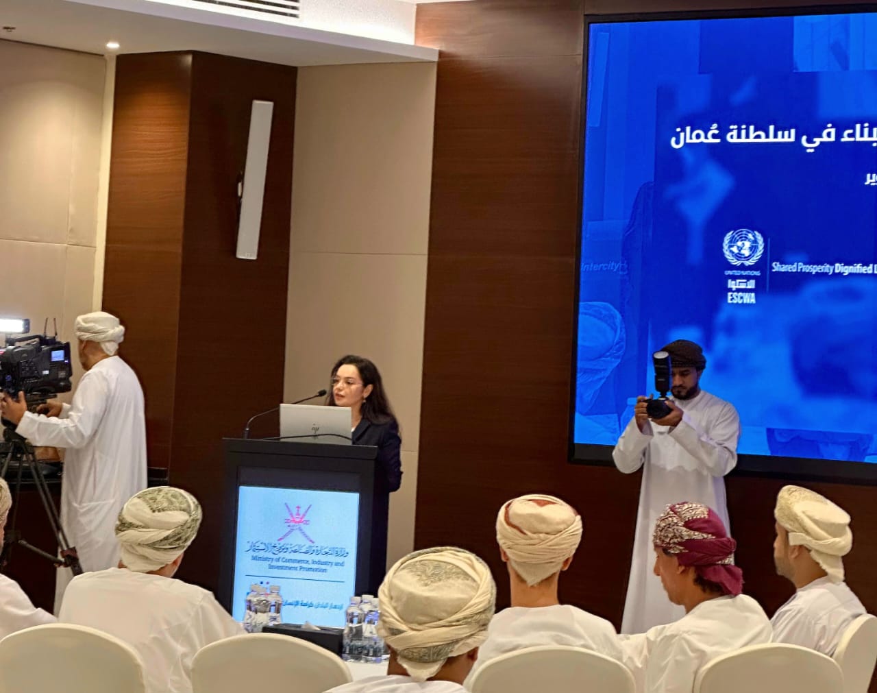 women on lectern presenting