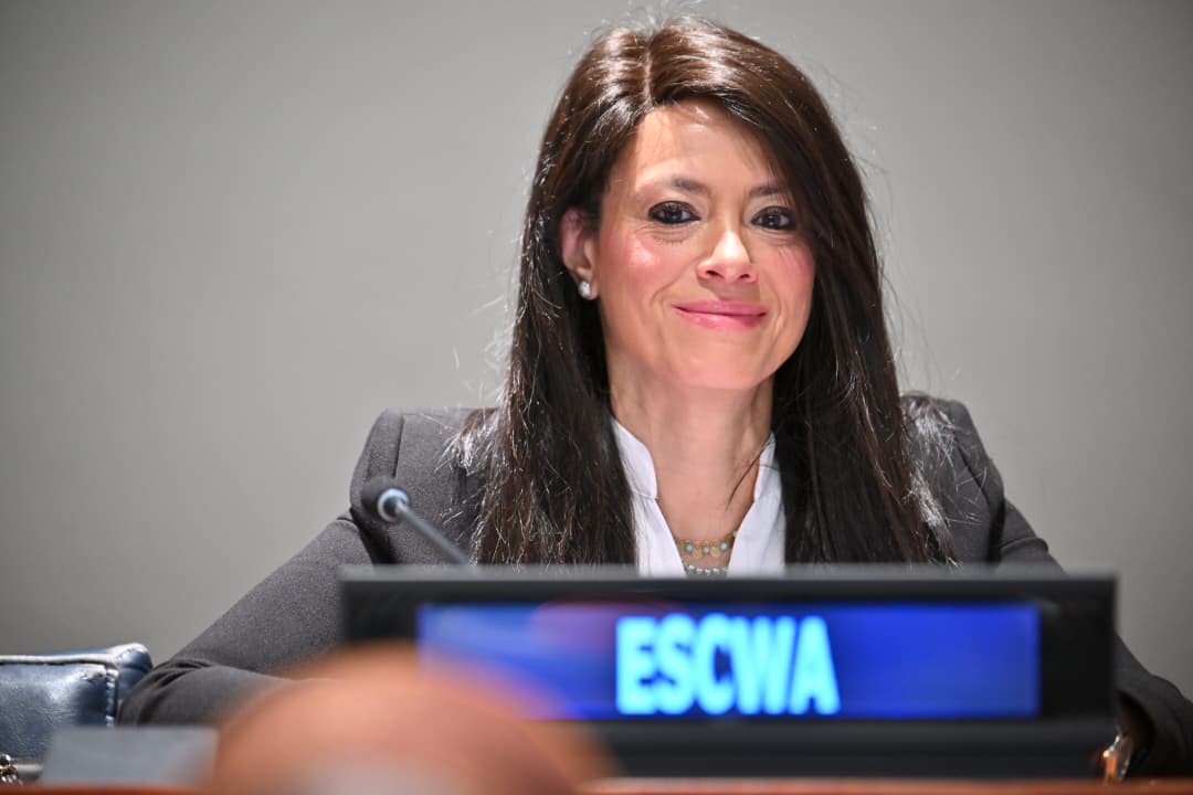Woman speaking behind mic