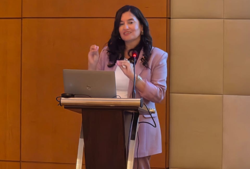 Woman speaking behind a lectern
