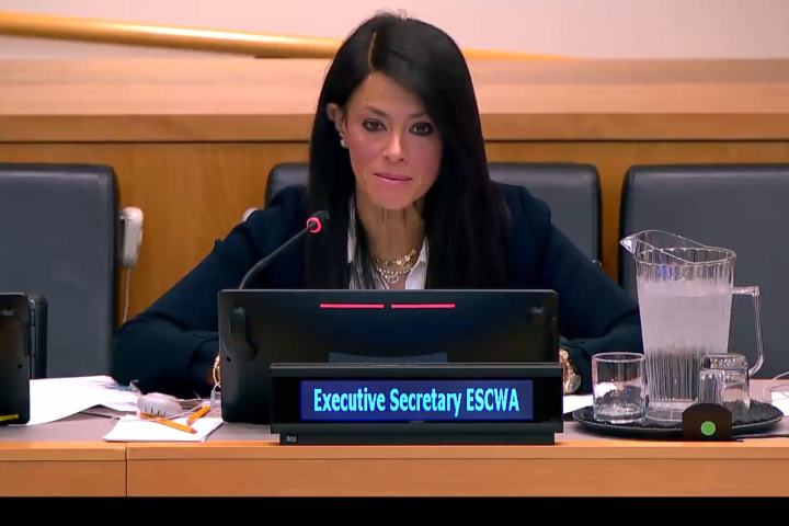 ES speaking behind mic