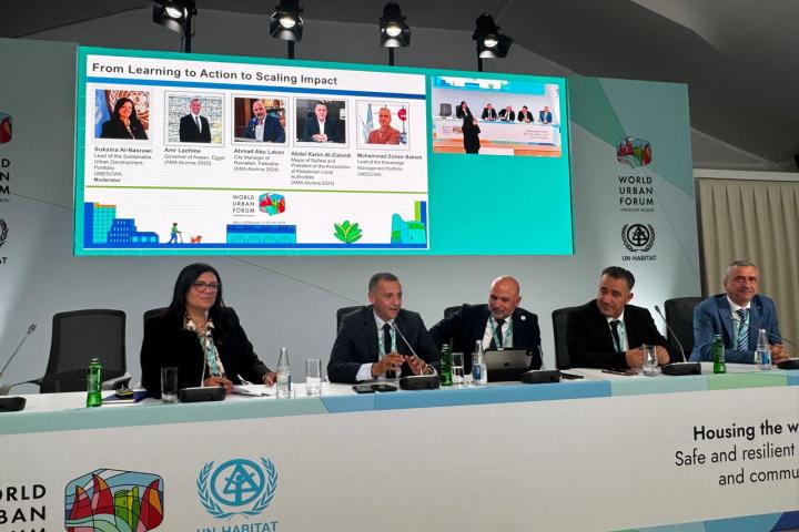 Panelists behind a table