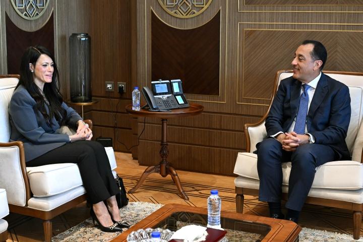 Two officials seated in a visit setup