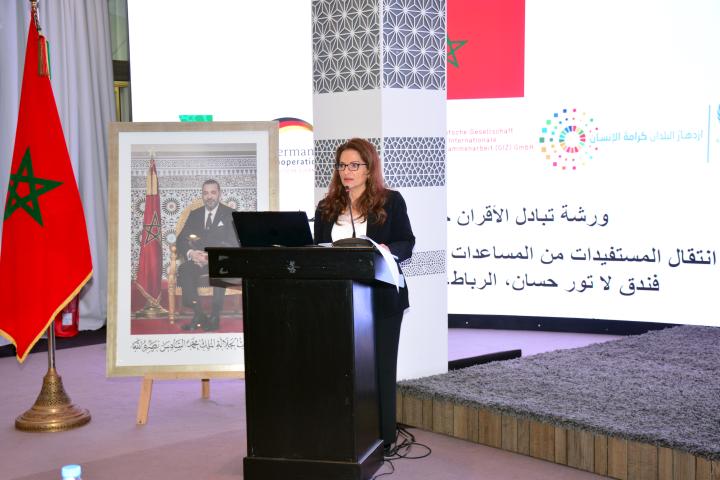 Woman at lectern addressing audience