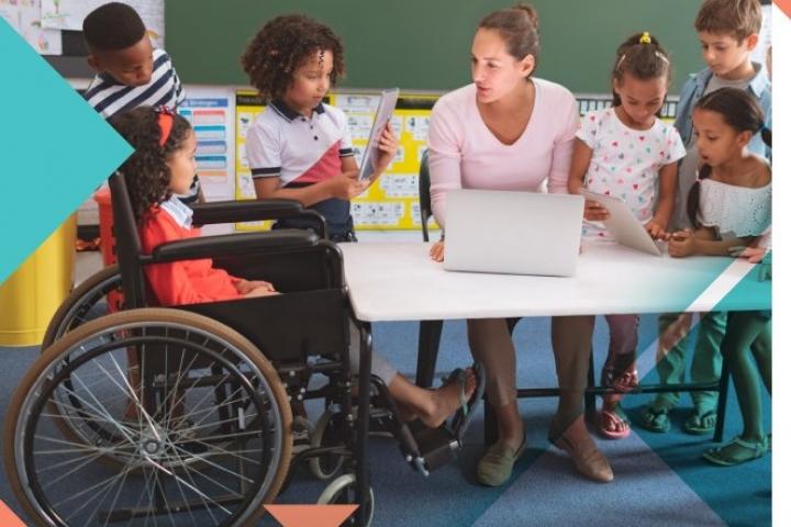 A teacher with a kid on a wheelchair