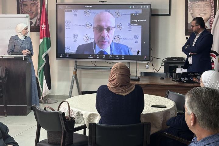 Participants looking at screen showing presenter